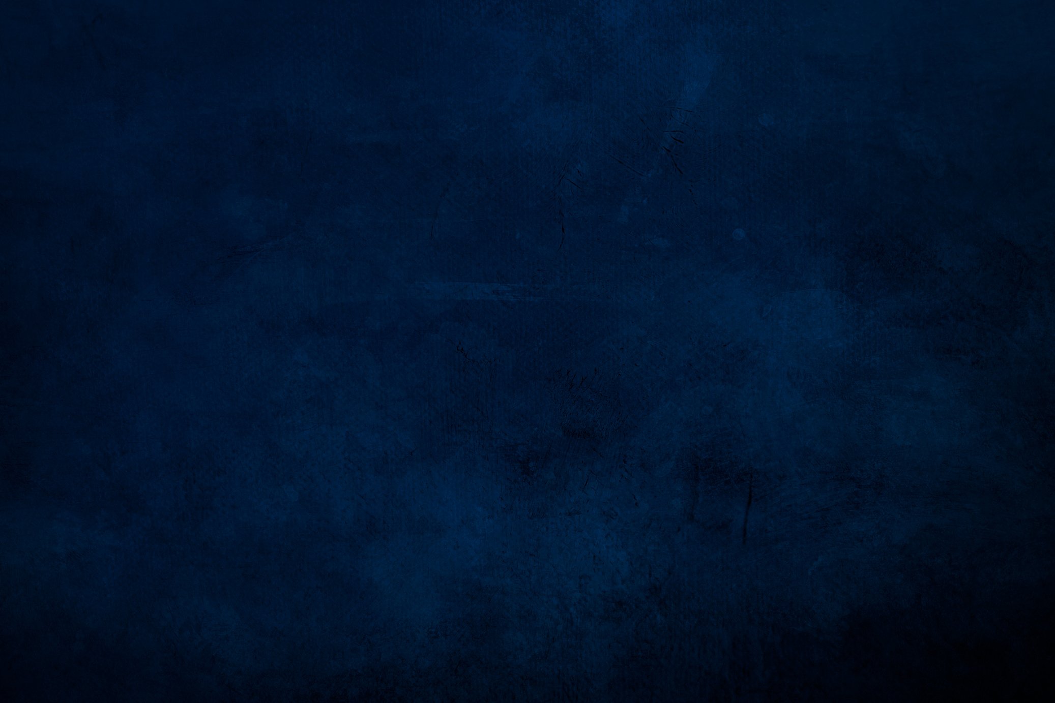 DArk blue  grungy canvas background or texture with dark vignette borders